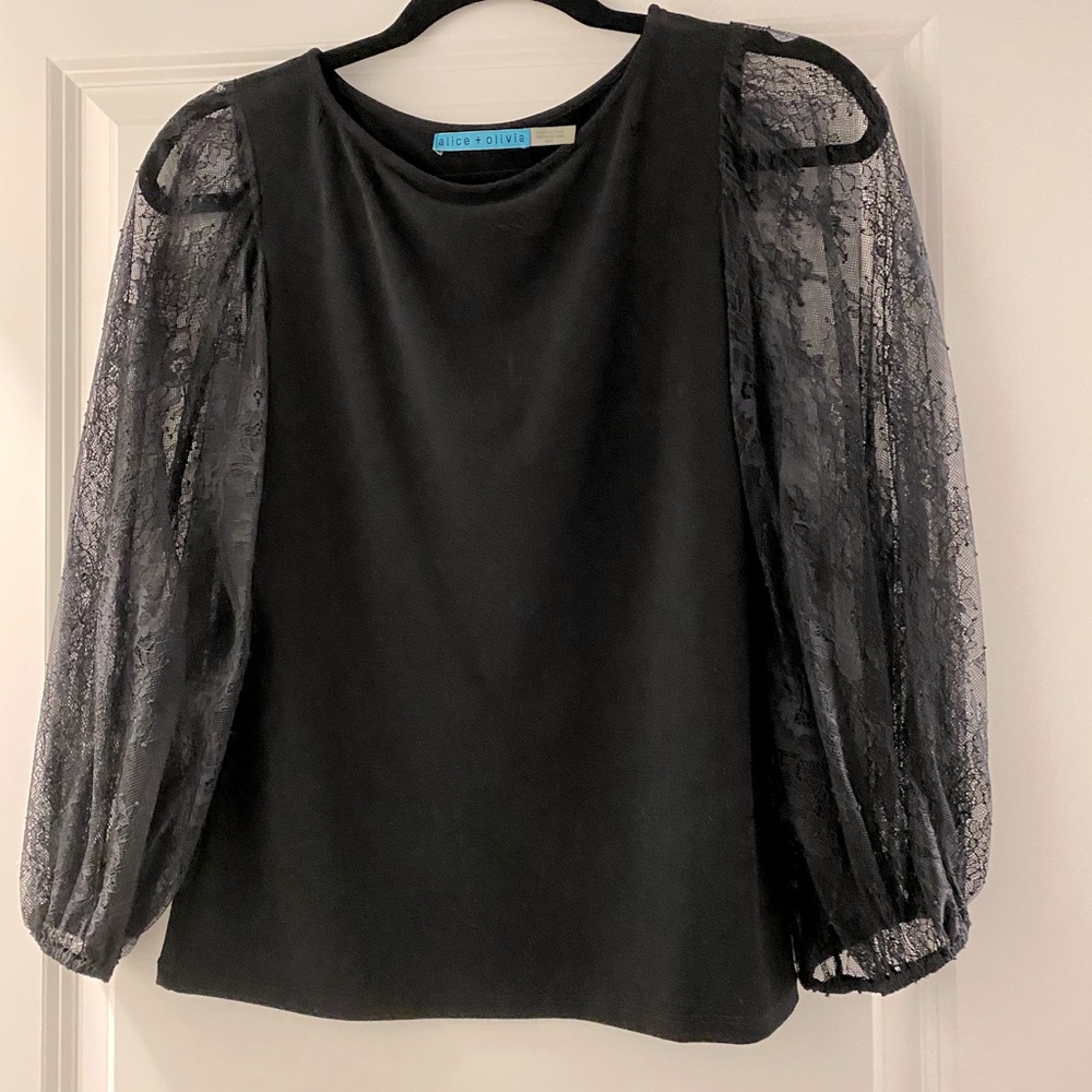 Black top with lace sleeves. Alive and Olive